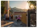 Sun sets over a lonely moped on Symi